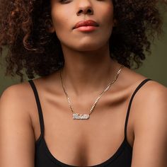 Our popular Double Plated Iced Out Script Name Necklace boasts a chic and elegant design, handcrafted to perfection. The model showcases the necklace with an 18-inch Cuban chain (see image for reference). Chain width:Cuban Chain - 3.7 mmFigaro Chain - 3 mmRope Chain - 2.3 mm Closure: All chains are fitted with a lobster clasp. Metal Selection: Gold Plated Silver Plated Sterling silver 14k gold plated over sterling silver 14k solid gold - (NAMEPLATE ONLY) Elegant Personalized Chain Link Necklace, Elegant Personalized Chain Link Necklaces, Elegant Metal Name Necklace With Adjustable Chain, Elegant Name Necklace With Adjustable Chain, Elegant Personalized Cuban Link Chain Necklace, Engraved Metal Chain Link Necklace, Elegant Personalized Link Necklaces, Elegant Engraved Cuban Link Jewelry, Elegant Engraved Chain Link Jewelry