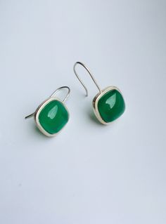 Lovely green jade cube earrings with sterling silver ear wire. They are made from high-quality jades and sterling silver. Simple and minimalistic design works great for all sort of occasion: dating, daily-wear, home or office, you name it. Perfect as a gift for your loved ones or yourself. Highlights: ♥ High-quality materials only Hanging quality dark green jade cubes, paired with 925 sterling silver ring. Ensure long last wear and great for sensitive skins. ♥ Simple and minimalistic design Grea Elegant Rectangular Emerald Earrings For May Birthstone, Elegant Rectangular May Birthstone Earrings, Rectangular Gemstone Earrings For May Birthstone, Square Hypoallergenic Earrings For Gift, Hypoallergenic Square Earrings As Gift, Hypoallergenic Square Earrings For Gifting, Hypoallergenic Square Earrings For Gifts, Classic Jade Jewelry With Matching Earrings, Modern Green Earrings As Gift