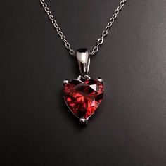 Solid Sterling Silver Garnet birthstone heart pendant, with Sterling Silver 18 inch chain. January Birthstone necklace making the perfect January birthday gift. Matching earrings available here: https://www.etsy.com/listing/1352764891/ Available to order in gold, white gold, rose gold or platinum, please contact me for prices.  💎Pendant thickness: 6mm 💎Pendant width: 9mm 💎Pendant overall Length: 17mm 💎Chain length: 18 inch or other length if required.  ✨ For free giveaways, special offers an Heart Cut Birthstone Jewelry Gift, Gift Heart Cut Gemstone Birthstone Necklace, Heart Cut Gemstone Birthstone Necklace Gift, Sterling Silver Heart Cut Birthstone Necklace For Gift, Red Heart Necklace With Birthstone As Gift, Red Heart Necklace With Birthstone For Gift, Red Heart Birthstone Necklace Gift, Heart Cut Birthstone Necklace As A Gift, Heart Necklace With Gemstone For Gifts