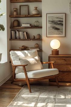 a living room filled with furniture and bookshelves next to a wall mounted shelf