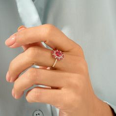 Celebrate your femininity with this gorgeous Ruby Floral Ring. This beautiful flower ring portrays elegance and charm. Made of 14k solid gold. Elegant Pink Ruby Ring With Brilliant Cut, Elegant Red Birthstone Ring With Rose Cut Diamonds, Elegant Pink Ruby Ring With Center Stone, Elegant Flower Shaped Birthstone Ring With Gemstone, Elegant Lab-created Ruby Diamond Ring With Accent Stones, Elegant Ruby Rings With Brilliant Cut, Elegant Rings With Lab-created Ruby And Accent Stones, Yellow Gold Flower-shaped Cubic Zirconia Rings, Elegant Ruby Ring With Prong Setting