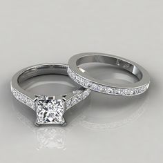 two white gold wedding rings with princess cut diamonds on the sides and pave set shoulders