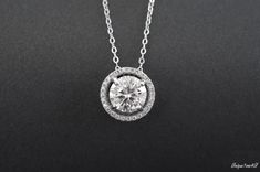 Gorgeous and delicate  Moissanite  necklace ， Nice gift for girlfriend/wife or Mother It comes with GRA Certificates， So please don't worry about quality， Every one is perfect！ Basic information  Stone： Top grade   Moissanite  Color Grade：D color Clarity Grade ： VVS1 Stone Shape: Circle  5mm/ 6.5 mm / 8mm / 9mm/ 10mm/11mm Stone weight ：0.5ct/ 1.0 ct / 2 ct / 3 ct /4 ct / 5 ct Metal Materials: Sterling Silver and Platinum Group Metal Multi-Layer Plating (Platinum Group Metals Multi-layer Plating Anniversary Sterling Silver Solitaire Necklace With Brilliant Cut, Round Solitaire Moissanite Necklace For Wedding, Anniversary Necklace With Halo Setting In Cubic Zirconia, Lab Grown Diamond Necklace With Brilliant Cut As Gift, Anniversary Necklace With Cubic Zirconia Halo Setting, Gift Diamond Necklace In Diamond White With Round Cut, Round Cut Jewelry With Prong Setting For Gift, Classic Sterling Silver Diamond Necklace As Gift, Classic Sterling Silver Diamond Necklace Gift