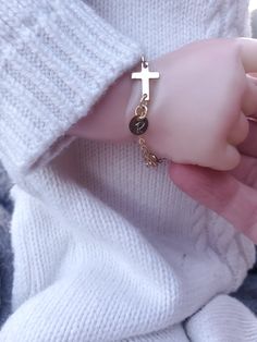 "Gold Cross Baby Bracelet/Baptism Bracelet Baby/Goddaughter Gift/Gift from Godmother Precious and Dainty!! This bracelet is made from 14 K Gold Filled chain. This chain is a sturdy 2x2.5mm. This more robust gauge helps prevent breaking from yanks or tugs from little hands! The Cross is also 14 K Gold Filled as well as the rings connecting the cross to the chain and the disc. The tiny disc, also 14 K Gold Filled, comes stamped with the initial of your choosing. Bracelet also comes with 1 inch ext Adjustable Gold Rosary Bracelet For Baptism, Gold Cross Bracelet For Baptism, Adjustable Gold Rosary Bracelet For Birthday, Personalized Gold Rosary Bracelet For Birthday, Personalized Gold Rosary Bracelet For First Communion, Personalized Gold Name Bracelet For Baptism, Personalized Gold Rosary Bracelet For Baptism, Personalized Cross Rosary Bracelet For Baptism, Baptism Bracelet