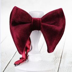 Introducing our exquisite collection of handmade velvet bowties, the epitome of timeless elegance and sophistication. Crafted with meticulous attention to detail, these bowties are designed to make a statement and elevate any gentleman's ensemble to new heights. Each bowtie is meticulously handcrafted using the finest quality velvet fabric, renowned for its luxurious texture and lustrous sheen. The softness of the velvet not only adds a touch of opulence but also ensures optimal comfort and a pe Adjustable Red Suit And Tie Accessories For Wedding, Red Bow Standard Bow Tie For Party, Red Bow Tie For Party, Red Bow With Butterfly Knot For Party, Elegant Red Bow With Butterfly Knot, Red Dapper Ties For Wedding, Red Dapper Tie For Wedding, Adjustable Red Bow Tie For Wedding, Dapper Red Bow Tie For Party