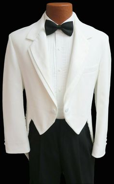 a white tuxedo with black pants and a bow tie