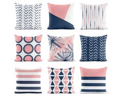 six pillows with different patterns on them, all in pink and navy blue color scheme