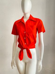 "CALVIN KLEIN Shirt circa 1970s Camp shirt in bright neon orange cotton. Notch collar, 2 front pockets and an elongated shirttail. SIZE: Small Bust: 32\" tight 34\" Waist: 30.5\" Shoulder seam to shoulder seam: 14.5\" Length center front: 27\" CONDITION: Excellent vintage condition. Ready to wear. SHOP POLICIES Please carefully read the measurements and look closely at the pictures before making a decision. We are precise with our measurements and descriptions and want to make sure that it looks Cheap Orange Button-up Blouse, Affordable Orange Short Sleeve Blouse, Calvin Klein Vintage, Calvin Klein Shirt, Camp Shirts, Camp Shirt, Notch Collar, Fashion Color, Camping Shirt