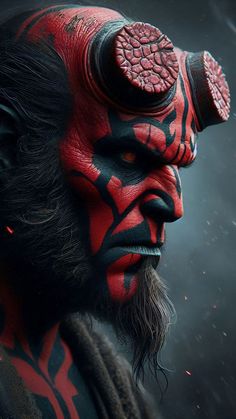 a man with red and black makeup on his face, wearing a horned headdress