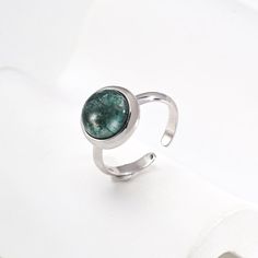 This delicate ring features stunning aquatic agate gemstones. The setting is meticulously crafted and the intricate details enhance the natural beauty of the stone, allowing its delicate hues to sparkle in the light. The adjustable strap ensures a comfortable fit, making it a versatile and elegant addition to any jewelry collection. Metal: 18K Recycled Gold Plated Vermeil on Recycled Sterling Silver,Recycled Sterling Silver Gemstone: Onyx 10mm Adjustable Ring Size: US 8 Water Grass, Edison Pearls, Onyx Gemstone, Tiger Eye Stone, Recycled Gold, Delicate Rings, Recycled Sterling Silver, Open Ring, Agate Gemstone