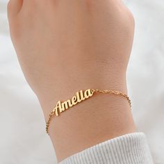 *Free TRACKABLE shipping within Canada and US.  This beautiful bracelet features a custom name charm made from silver and 18k gold PVD plated stainless steel and 9 different chain types to choose from. Available in lengths of 6 to 8 inches. A lovely gift or a special treat for yourself! Font type in photos: Amelia: Font 2 Sophia: Font 1 Material: Stainless Steel Chain Types: Figaro                         Rolo (2mm)                         Medium Paperclip (3.5x12mm)                         Curb Everyday Customized Stainless Steel Jewelry, Classic Gold Name Bracelet In Stainless Steel, Customizable 14k Gold Bracelet Jewelry, Customizable 14k Gold Bracelet, Custom Name Gold Bracelet For Everyday, Customized Gold Elegant Chain Bracelet, Personalized Yellow Gold Plated Bracelets, Customized Minimalist Stainless Steel Bracelets, Custom Name Gold Bracelets For Everyday