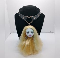 "Handmade OOAK Lagoona Blue choker necklace! Black vegan leather strap with silver colored heart and rhinestone studs. Approx 14\"-15.5\" adjustable snap closure. Made with a real Mattel Monster High Lagoona head that has been customized with nose and ear piercings! Brand new, never worn! NOTE: Some flaws on her lip and face paint (still gorgeous tho!) Keywords: Monster High Student Fairy Kei Fairycore Faecore Fairywave Cute Anime Original Large Big Gift Weird Unique Funny Gift Kawaii Toy Barbie Adjustable Emo Choker For Cosplay, Handmade Adjustable Choker For Cosplay, Handmade Adjustable Choker For Alternative Fashion, Adjustable Emo Choker For Alternative Fashion, Adjustable Choker For Cosplay, Adjustable Metal Choker For Cosplay, Adjustable Silver Choker For Cosplay, Alternative Adjustable Choker For Gift, Alternative Style Adjustable Choker As A Gift