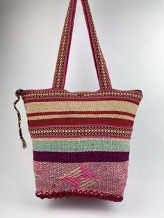 "Wear a unique piece of art, add versatility, style, and color to your daily life, and support fair trade a woman's small business \"This popular canvas tote bag has been made by artisan families who employ Peruvian ancestral techniques to create this unique fashion piece. This piece contains looms with more than 10 years.\" The benefits of your purchase ★ Style , contrast & awareness  ★Dress One of kind accessories ★ 100%  knitted natural accessories made by small business ★ Toiletry Bag made o Multicolor Tote Hobo Bag For Everyday Use, Large Capacity Multicolor Hobo Bag For Travel, Large Multicolor Shoulder Bag For Travel, Handwoven Shoulder Bag With Double Handle For Daily Use, Large Multicolor Beach Bag For Travel, Handwoven Double Handle Shoulder Bag For Daily Use, Beige Hobo Shoulder Bag For Festival, Daily Use Handwoven Shoulder Bag With Double Handle, Handwoven Tote Shoulder Bag For Daily Use