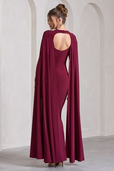 Opt for opulence at your next black tie event in Standing Ovation. This enchanting burgundy maxi dress was designed in our signature stretch jersey that hugs each curve and effortlessly accentuates your frame. Defined by extravagant cape sleeves. keep Standing Ovation at the forefront by styling it with a tousled bun and strappy stilettos. Features - Premium stretch jersey - Plunge neckline- Cape sleeves- Knot detail - Open back- Invisible zip closure - Fishtail skirt- Maxi length Sizing & Fit M Burgundy Maxi Dress, Standing Ovation, Black Dress Prom, Fishtail Skirt, Black Tie Gala, Strappy Stilettos, Party Dress Long Sleeve, Skirt Maxi, Cape Sleeves