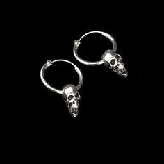 Sterling silver hoop earring has a diameter of 7/8 inch with a 5/8 inch silver plated pewter skull hanging from it. It latches by fitting the wire section back into the hollow hoop. The hoop is 7/8 inch x 2mm thick. The combined pieces measure 1.25 inches. These are sold per pair. This piece of jewelry is sent in a bubble pack envelope via US postal service, first class mail with insurance, free in the US. International rate is $15. Buyers are responsible for any customs and import taxes that ma Skull Earring, Screaming Skull, Skull Hanging, Skull Jewelry, Skull Earrings, Sterling Silver Hoop Earrings, Sterling Silver Hoops, Jewelry Companies, Silver Hoops