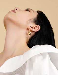 Presented in sterling silver, brass, or resin, Naida is accentuated with a signature blob, and tipped with a mini droplet to complete the vibe. Without excess elements, this piece is lending a luxurious yet elegant appeal.- 14K gold plated brass- sterling silver ear post with 14K gold plating- 7cm (2.8in) drop- handcrafted jewelryDelivered in vacuumed package with unique production number, accompanied by a pouch. Seen | Unseen series conveys another contrasting architectural relations, transpare Modern Drop Matching Earrings Jewelry, Gold Single Drop Earring In Modern Style, Modern Gold Jewelry With Pearl Drop, Polished Drop Earrings For Gift, Polished Finish Drop Earrings For Gift, Elegant Polished Linear Earrings As Gift, Elegant Linear Earrings With Polished Finish For Gift, Elegant Linear Earrings With Polished Finish As Gift, Contemporary Teardrop Jewelry For Pierced Ears