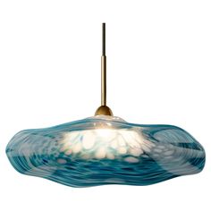 Perla takes inspiration from the oyster, with the distinctive, organic form of the decorative hand spun glass shade representing the shell, with the central light source acting as the pearl. The result is a soft and graceful luminaire that adds a flowing natural beauty to any luxury interior. Handcrafted in the UK by trusted and experienced artisans, the delicate glass shade is available in three vibrant tones that offer a distinctive and refined character. As each shade is hand-finished, each p Shell Pendant Light, Cluster Pendant Lighting, Gallery Lighting, Organic Glass, Cluster Pendant, Organic Form, Glass Pendant Light, Shell Pendant, Chandeliers And Pendants