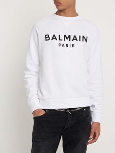 Find BALMAIN Logo Printed Sweatshirt on Editorialist. Reglan sleeves. Ribbed cuffs and hem. Printed front panel. Model is wearing a sizeM Balmain Shirt, Balmain Sweater, Balmain Blazer, Balmain Men, Black Crewneck Sweatshirt, Like Green, Sweatshirt White, Black Crewneck, Sports Hoodies