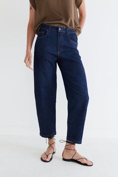 Our classic barrel leg denim pants in a new dark wash. A tapered leg and a wider leg makes for a flattering fit. Barrel leg Belt loops 2 side pockets 2 Back Pockets Slight stretch Classic Indigo Tapered Leg Bottoms, Dark Wash Straight Leg Cropped Jeans For Work, Modern Tapered Leg Cropped Denim Jeans, Workwear Cropped Straight Leg Jeans In Dark Wash, Modern Cropped Tapered Leg Denim Jeans, Dark Wash Cropped Mom Jeans, Straight Leg Cropped Jeans In Dark Wash For Work, Modern Cropped Tapered Leg Jeans, Dark Wash Mom Fit Cropped Jeans