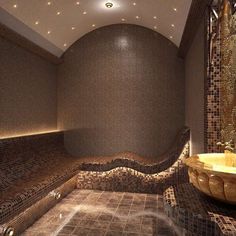 a bathroom with a large round sink and tiled walls