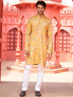 This yellow floral cotton print kurta will instantly give an elegant look.  Made from cotton fabric, this yellow kurta with floral print has front buttons fastening, and a mandarin collar. It is paired with a white cotton stretch churidar pants. An ideal outfit for traditional & special events.

Size Chart For Men





	
	
					Men's Size Chart
		

		
		
						
				Size Chart For Men
				Custom Size Measurement Guide
			
			
				
				
				Custom Size Measurement Guide
1. Take your measurements a Yellow Floral Print Kurta For Diwali, Festive Yellow Kurta With Floral Print, Yellow Printed Kurta For Spring, Yellow Floral Print Kurta For Festive Occasions, Yellow Printed Long Sleeve Kurta, Yellow Printed Long-sleeve Kurta, Festive Yellow Printed Kurta, Yellow Printed Unstitched Kurta, Yellow Printed Cotton Kurta