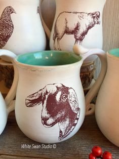 some ceramic jugs with animals painted on them