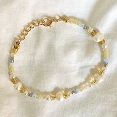 Beaded Bracelet   Hand beaded - real fresh water pearls and seed beads It is not recommended to wear bracelets or necklaces in water - swimming, showering etc.   Delicate - handle with care Adjustable in size! Summer Pearl Beaded Bracelets For Beach, Bohemian Pearl Beaded Bracelets, Summer Gold Beaded Pearl Bracelet, Pearl Beaded Bracelets With Gold And Round Beads, Handmade Gold Pearl Bracelet For Summer, Pearl Bracelet With Tiny Round Beads, Beach Pearl Beaded Bracelets With Tiny Beads, Pearl Beaded Bracelets For Beach With Tiny Beads, Adjustable Pearl Beaded Bracelets For Summer