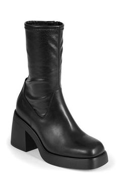 Enhance your ensemble with a bit of drama in this stretchy, contour-hugging boot set on a square-toe platform and conspicuously chunky block heel. 3 1/4" heel 9 1/4" shaft Side zip closure Synthetic upper/leather lining/synthetic sole Imported Fall Heeled Boots With Chunky Platform And High Shaft, Edgy Chunky Platform Boots With Square Toe, Edgy Fitted Heeled Boots With Square Toe, Trendy Wide Calf Platform Boots With Stacked Heel, Edgy Platform Heeled Boots With Square Toe, Edgy Square Toe Platform Heeled Boots, Edgy Square Toe Platform Boots For Fall, Fitted Heeled Boots With Chunky Platform And Square Toe, Fitted Chunky Platform Heeled Boots With Block Heel