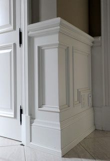 an empty room with white doors and tile flooring