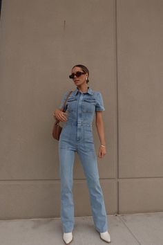 Introducing our Chelsey Denim Jumpsuit, a versatile and stylish addition to your wardrobe. Chic Medium Wash Denim Jumpsuit With Pockets, Chic Medium Wash Jumpsuits And Rompers With Pockets, Chic Non-stretch Medium Wash Denim Jumpsuit, Chic Medium Wash Non-stretch Denim Jumpsuit, Chic Denim Jumpsuit With Pockets, Medium Wash Denim Overall Jumpsuit For Day Out, Light Wash Denim Overall Jumpsuit For Day Out, Medium Wash Fitted Overall Jumpsuit, Fitted Medium Wash Overall Romper