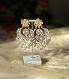 A perfect grey kundan/chandbali earring for your next event! Luxury Meenakari Temple Jewelry Pearl Earrings, Silver Kundan Necklace With Gota Work For Gift, Elegant Jhumkas With Gota Work For Parties, Silver Meenakari Chandelier Earrings For Festivals, Elegant Silver Jhumkas With Gota Work, Silver Pearl Earrings With Stone Work For Celebration, Elegant Zari Work Danglers For Celebration, Elegant Danglers With Zari Work For Celebration, Silver Kundan Pearl Earrings With Stone Work