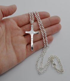 Sterling Hammered Cross Necklace Handmade Wild Prairie Silver Jewelry I hand make and hammer these sterling silver crosses to rustic perfection one at a time in rural Wisconsin. Heavy sterling silver cross with a hammered finish is made to last forever. This beautiful hand made cross Adjustable Cross Pendant Necklace, Handmade Cross Jewelry For Memorial, Personalized Crucifix Cross Necklace, Personalized Silver Cross Necklace, Personalized Memorial Cross Jewelry, Sterling Silver Crosses, Hammered Cross Necklace, Personalized Cross Necklace, Silver Cross Necklace