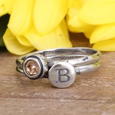 "This set of two stackable rings can represent the initial and birthstone of your child or any loved one. This also makes a great gift for graduation or a birthday. Or, wear your own birthstone and initial! Add to this ring over time by stacking more bands. Give the gift of this perfect mother's or grandmother's stacking ring set! Need more than 2 rings in your set? Create your own stack here: https://www.etsy.com/listing/230740149 These rings are also available in GOLD: https://www.etsy.com/lis Ring Set Silver, Stackable Birthstone Rings, Ring Initial, Mother's Ring, Birthstone Stacking Rings, Gift For Graduation, Stack Rings, Multiple Rings, Family Rings