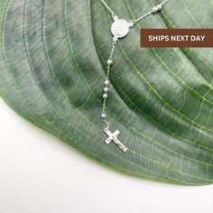 - Ships in 1 business day   - Sterling Silver - Measure: 20.5 inches length with 4 inches hang - Measure: 24 inches length with 4 inches hang - Weight: Between 6-8 grams Sterling Silver Necklace Dainty, Catholic Jewelry, Boutique Logo, Rosary Beads, Necklace Dainty, Lariat Necklace, Silver Cross, Sterling Silver Necklace, Tassel Earrings