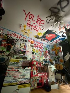 a room filled with lots of graffiti and writing on the walls, including letters that spell out you're perfect