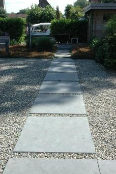 a stone path in front of a house