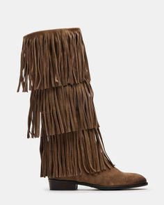 Upgrade your wardrobe with the SPUR fringe boot. These boots feature a fringe detailing that adds a touch of effortless style. Perfect for any occasion, these boots will elevate your look while providing comfort and durability. 1 inch heel height 14.5 inch shaft circumference 15 inch shaft height Suede upper material Synthetic lining Leather sock Synthetic sole Fit tip: If you are in between sizes, size up a half-size Imported Western Suede Fringe Boots, Western Style Suede Boots With Fringe, Leather Fringe Boots For Fall, Winter Fringe Ankle Boots, Brown Fringe Winter Boots, Casual Fringe Boots For Fall, Light Brown Cowgirl Boots, Fringe Boots Outfit, Boots With Tassels