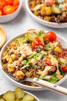 a salad in a bowl with dressing on the side