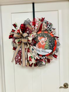 a christmas wreath hanging on the front door