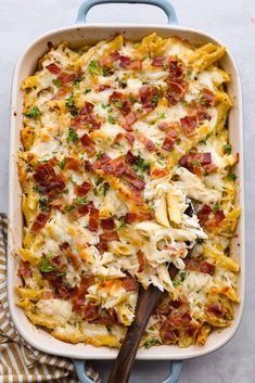 a casserole dish filled with pasta and bacon