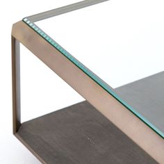 a close up of a glass and metal shelf