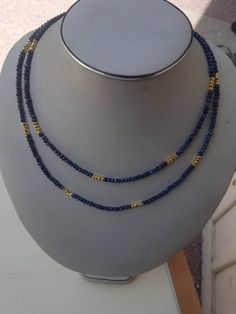 "Lapis fact rondelle 4mm beaded necklace 40\". with golden pyrite beads and silver spring clasps with gold polish. semiprecious beads color: blue and golden. beautiful ready to wear." Gold Lapis Lazuli Necklace With Faceted Beads, Gold Lapis Lazuli Faceted Beads Necklace, Gold Gemstone Beaded Rondelle Necklaces, Gold Rondelle Beaded Necklaces With Gemstone Beads, Gold Rondelle Gemstone Beaded Necklace, Gold Rondelle Beaded Necklace With Gemstone Beads, Gold Double Strand Polished Beads, Gold Polished Double Strand Beads, Black Pearl Jewelry