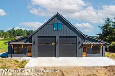 a large house with two garages on top of it