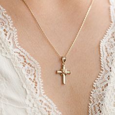 14k Gold Cross Pendant, Religious Jewelry, Christening, Dainty Cross Necklace, 14k Yellow Gold Crucifix Pendant, 16mm Small Size *Free Express International Shipping *14K solid gold chain is included if you choose. NEXT BUSINESS DAY SHIPPING! PRODUCT DETAILS *The product is made of 100% 14k Solid Gold and it has a 14K or 585 stamp on item. (We don't sell filled or plated jewelry) *The package includes a gold certificate.  *The product includes 14K solid gold chain. *Every package comes in a gift box. *14K gold indicates that the product is produced from 58% pure gold. *Chain thickness: 1.00mm *Pendant measures: 16.00mmx12.50mm (small size) *The product is yellow gold. *       Made in Türkiye. ORDER PROCESS *We have some options for the chain length.  ABOUT SHIPPING We ship all packages saf 14k Gold Crucifix Jewelry As Gift, Delicate Cross Jewelry For Wedding, Wedding Necklace With Diamond Cut Cross Pendant, 14k Gold Cross Pendant Jewelry For Wedding, Wedding Cross Pendant Necklace With Diamond Cut, Fine Jewelry Wedding Necklace With Hallmark, Yellow Gold Necklace With Hallmark For Wedding, Wedding Cross Pendant Necklace With Engraving, 14k Gold Necklaces For Wedding