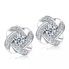 The Isabella Earrings Are A Timeless Classic Featuring Encrusted Crystals Surrounding An Exquisite Cubic Zirconia Center. Earrings Are Sterling Silver. Wedding Earrings Studs, Wedding Studs, Knot Stud Earrings, Earring Designs, Silver Jewellery Sets, Diamond Earring, Knot Earrings, Love Knot, Crystal Stud Earrings