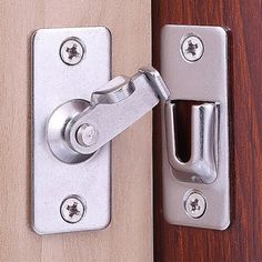 a close up of a door handle on a wooden door