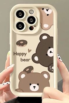 a woman holding up a phone case with bears on it and the words happy bear