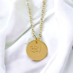 This Birth Month Flower Pendant Necklace is the ideal gift to celebrate a special birth month. With its elegant flower design, it is a thoughtful way to show your loved ones how much you care. Consider giving this unique piece of jewelry as a token of your affection. Material: 14K gold filled and plated Chain: 14K gold filled 16.5” Rolo chain Pendant: 14K gold plated hand stamped flower Lead and nickel free Delivered in a soft protective jewelry pouch and gift box Crafted in the USA Ships from M Dainty Birth Flower Medallion Necklace, 14k Gold Birth Flower Pendant Jewelry, Yellow Gold Charm Necklace With Flower For Wedding, Yellow Gold Birth Flower Charm Necklace, 14k Gold Birth Flower Jewelry For Mom, Yellow Gold Flower Pendant Charm Necklace For Mother's Day, Anniversary Medallion Necklace With Flower Charm, Gold Charm Necklace With Flower For Anniversary, Gold Flower Charm Necklace For Anniversary