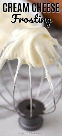 cream cheese frosting in a wire whisk