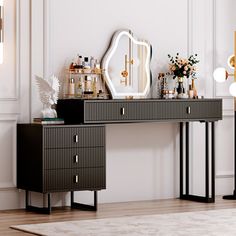 an elegant dressing table with mirrors and vases